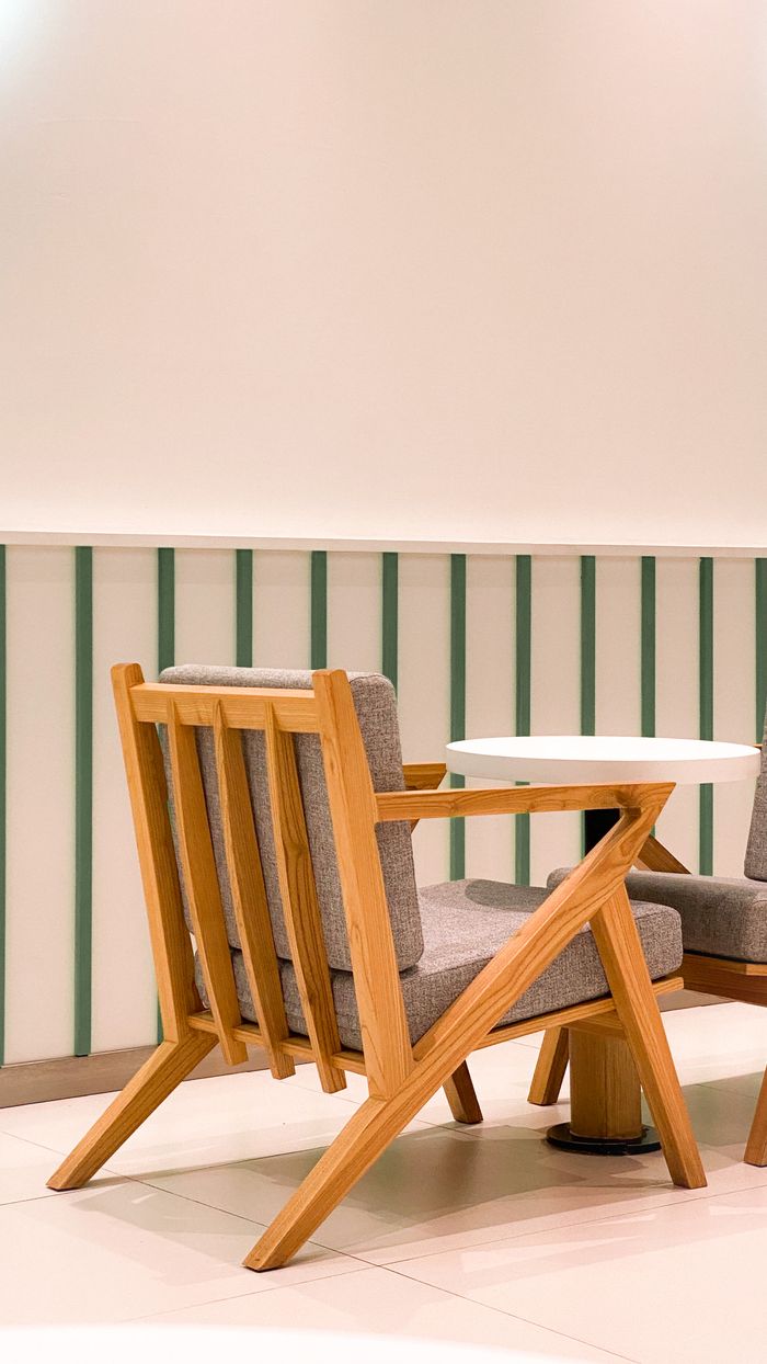 Elegant wooden chair with a minimalist design, perfect for modern interiors.